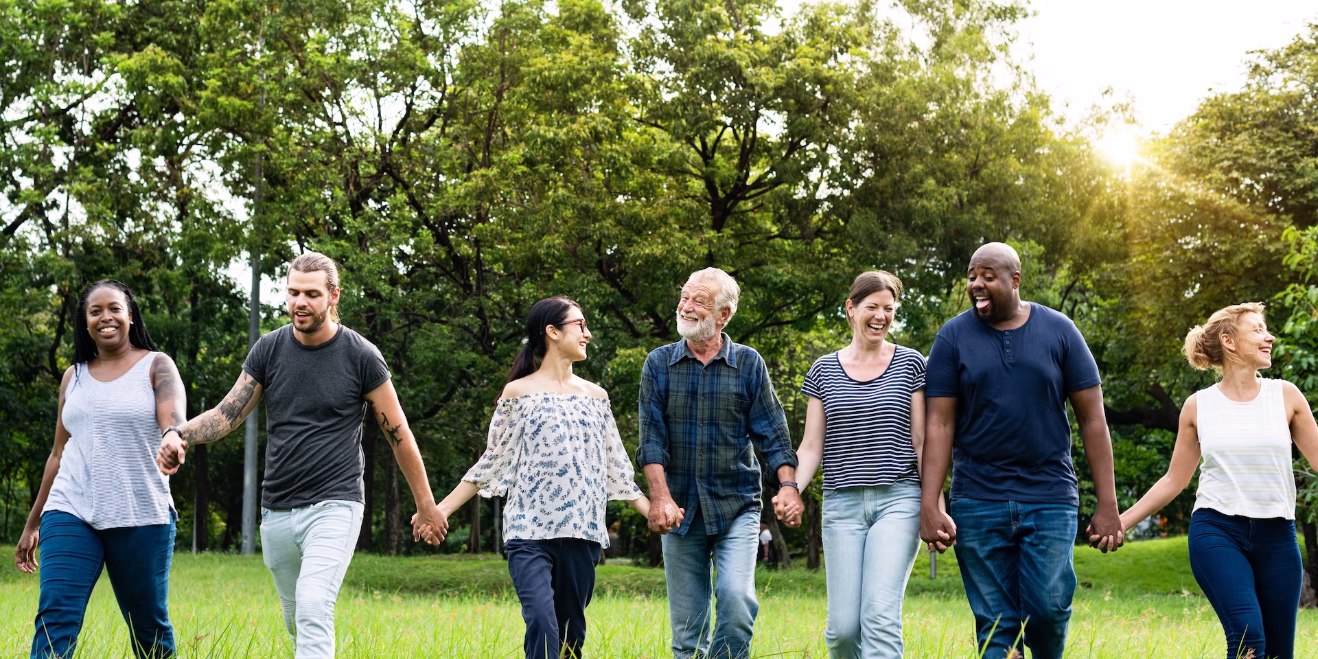 diverse-group-friends-hold-hands-park-diverse-group-men-women-standing-together-hold-hands-park-diverse-group-friends-men-women-standing-row-hold-hands-grass